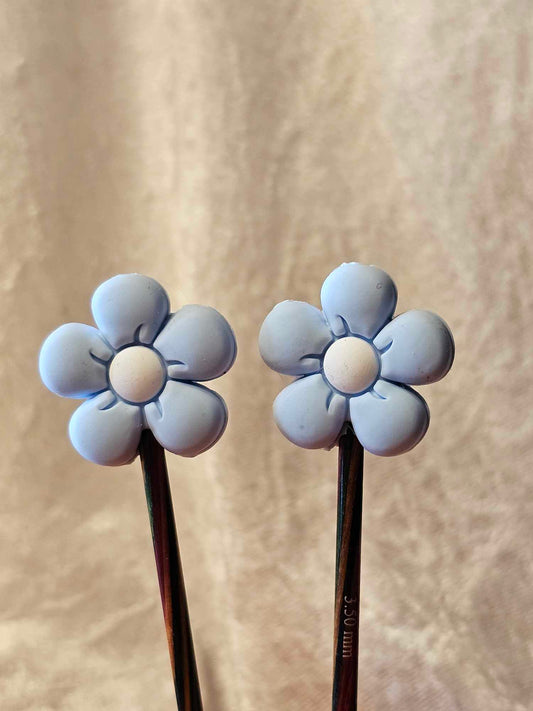Lyseblå blomster maskestopper